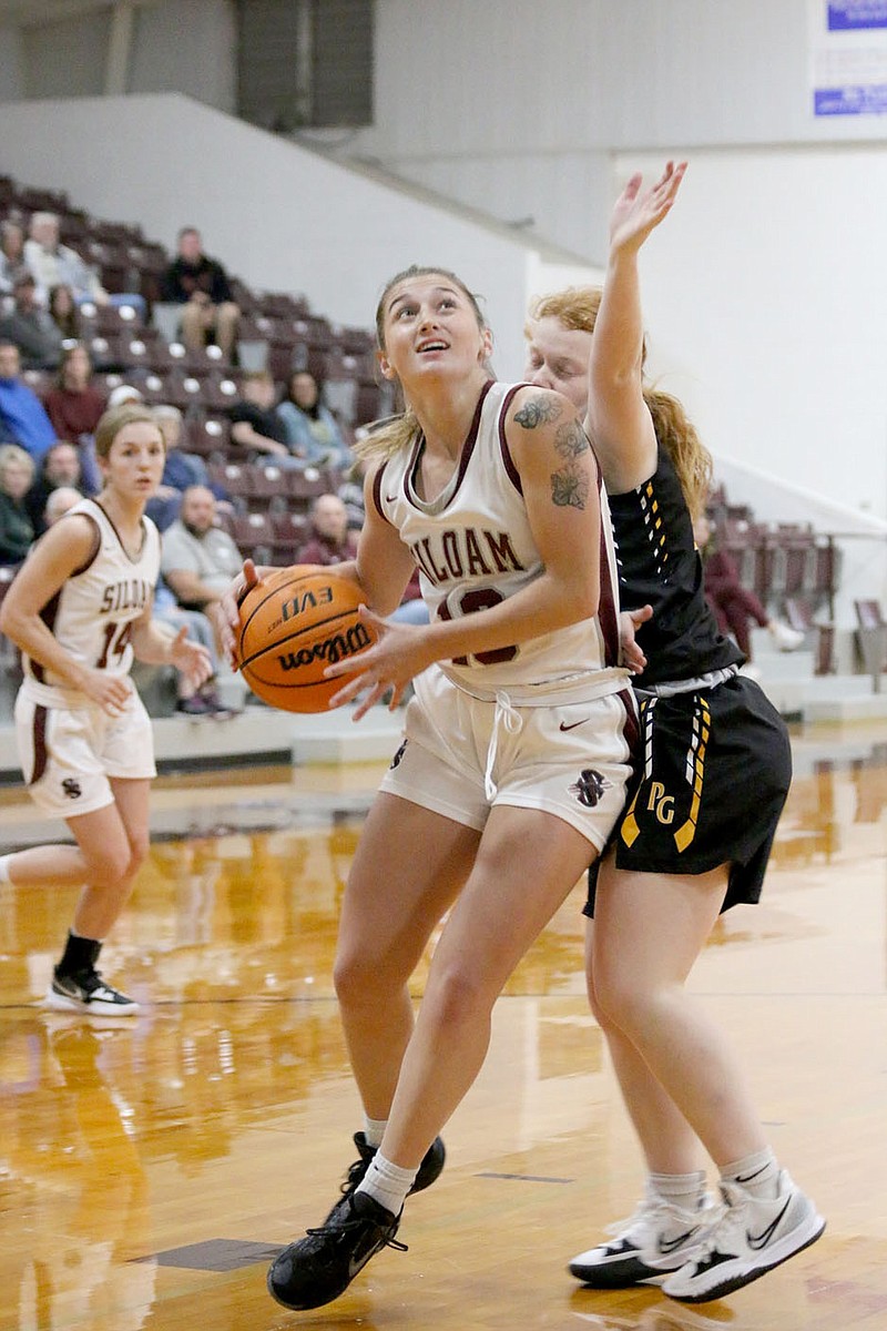 Mark Ross/Special to the Herald-Leader
Siloam Springs junior Faith Ellis drives to the basket against Prairie Grove on Nov. 18 at Panther Arena. The Lady Panthers (4-0) play at Huntsville on Friday.