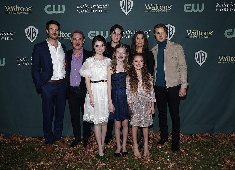 “The Waltons” are Ben Lawson (from left), Richard Thomas, Marcelle LeBlanc, Christian Finlayson, Tatum Matthews, Callaway Corrick, Bellamy Young and Logan Shroyer. The photo was taken at the screening and reception celebrating “The Waltons: Homecoming” in North Hollywood, Calif. (Getty Images/TNS/Kevork Djansezian)