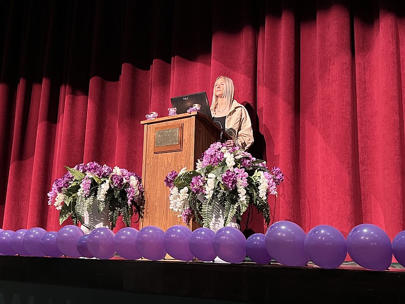 ALEXUS UNDERWOOD/SPECIAL TO MCDONALD COUNTY PRESS Domestic violence survivor Allie Stephens sharing her experiences with the McDonald County High School student body. Stephens shares 43% of women in college report experiencing domestic violence and different types of abuse.