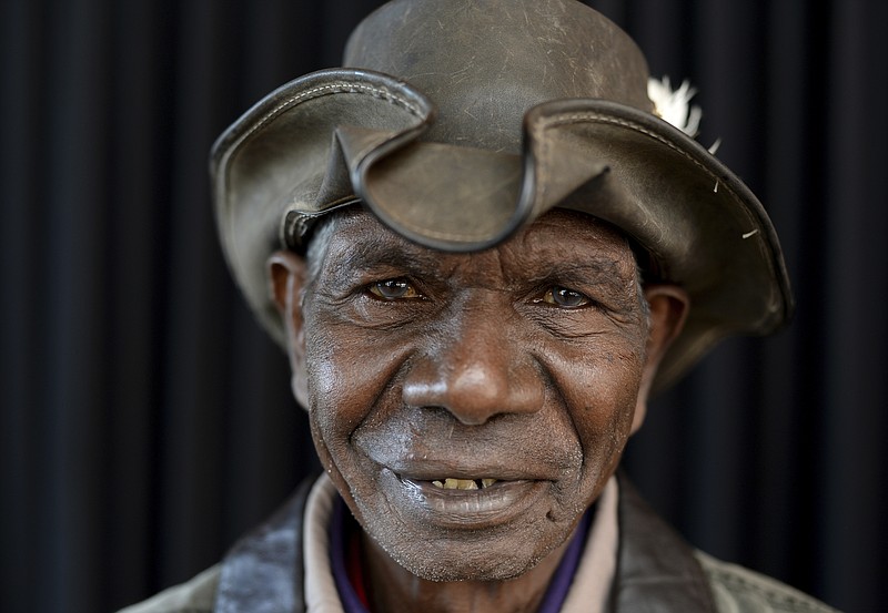 Australian Indigenous actor David Gulpilil, winner of the Red Ochre, the major award at the 6th National Indigenous Arts Awards, poses for a photograph at The Sydney Opera House, Sydney on Monday, May 27, 2013. Gulpilil has died of lung cancer, a government leader said on Monday, Nov. 29, 2021. He was 68 years old. (Dan Himbrechts/AAP Image via AP)