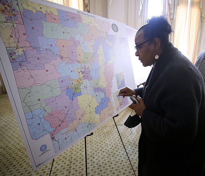 Little Rock NAACP president Dianne Curry looks over the Arkansas House of Representatives maps after the Board of Apportionment meeting on Monday, Nov. 29, 2021, at the state Capitol in Little Rock. 
(Arkansas Democrat-Gazette/Thomas Metthe)