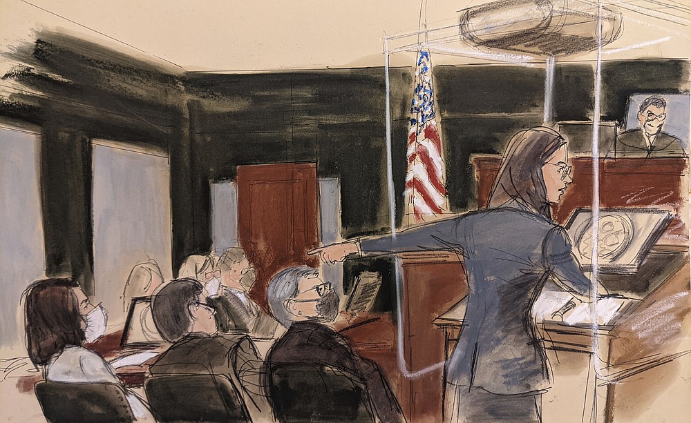 In this courtroom sketch, assistant U.S. Attorney Lara E. Pomerantz gives her opening statement while pointing to Ghislaine Maxwell, seated far left, Monday, Nov. 29, 2021, in New York. Two years after Jeffrey Epstein's suicide behind bars, a jury is set to be picked to determine whether his longtime companion, Maxwell, was his puppet or accomplice. (AP Photo/Elizabeth Williams)
