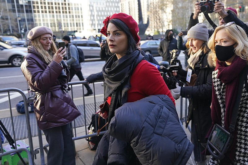 Sarah Ransome, an alleged victim of Jeffrey Epstein and Ghislaine Maxwell, arrives to the courthouse for the start of Maxwell's trial in New York, Monday, Nov. 29, 2021. Two years after Jeffrey Epstein's suicide behind bars, a jury is set to be picked Monday in New York City to determine a central question in the long-running sex trafficking case: Was his longtime companion, Ghislaine Maxwell, Epstein's puppet or accomplice? (AP Photo/Seth Wenig)