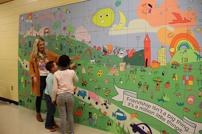 LYNN KUTTER ENTERPRISE-LEADER
Students at Folsom Elementary School in Farmington came up with the theme, &quot;Friendship and Unity,&quot; for their new mural, now installed on a wall at the school. The mural is made up of artwork created by every student in the building. Teachers at the school came up with the phrase on the mural, &quot;Friendship isn't a big thing, it's a million little things.&quot;