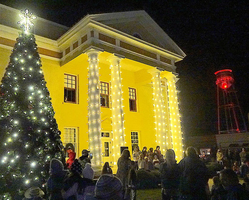Linden, Texas, will hold its Christmas tree lighting ceremony 6 p.m. Thursday on the square. This photo is from last year’s event, showing the town’s newly lighted water tower in the distance. School choirs are singing on the steps.