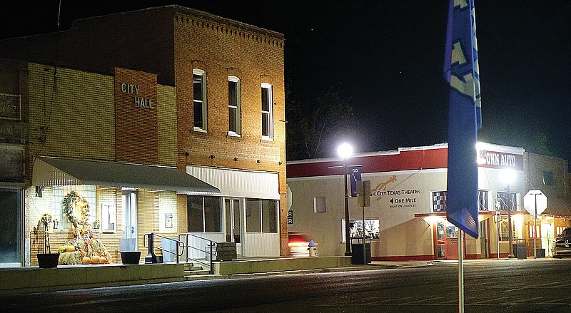 Linden’s city hall, main corner and business crossing are illuminated at night.