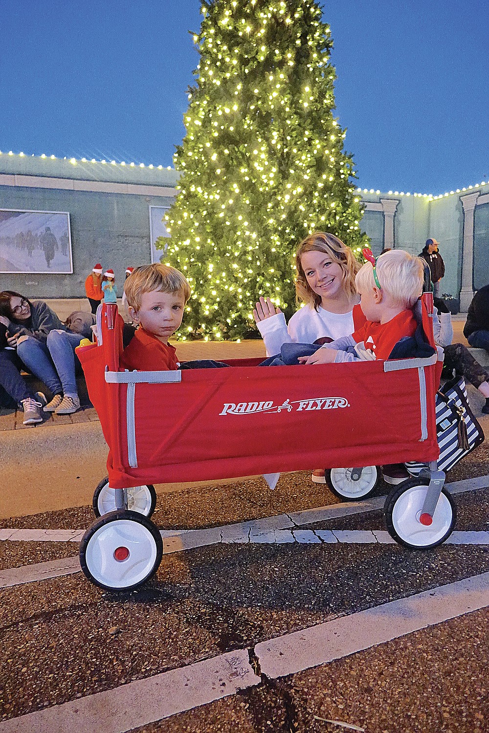 During last year’s Christmas parade in downtown Atlanta, Caitlyn Trim had just the right vehicle for her sons  Cameron, left, and Cooper. The wagon was warm, and they could easily keep up with the parade.