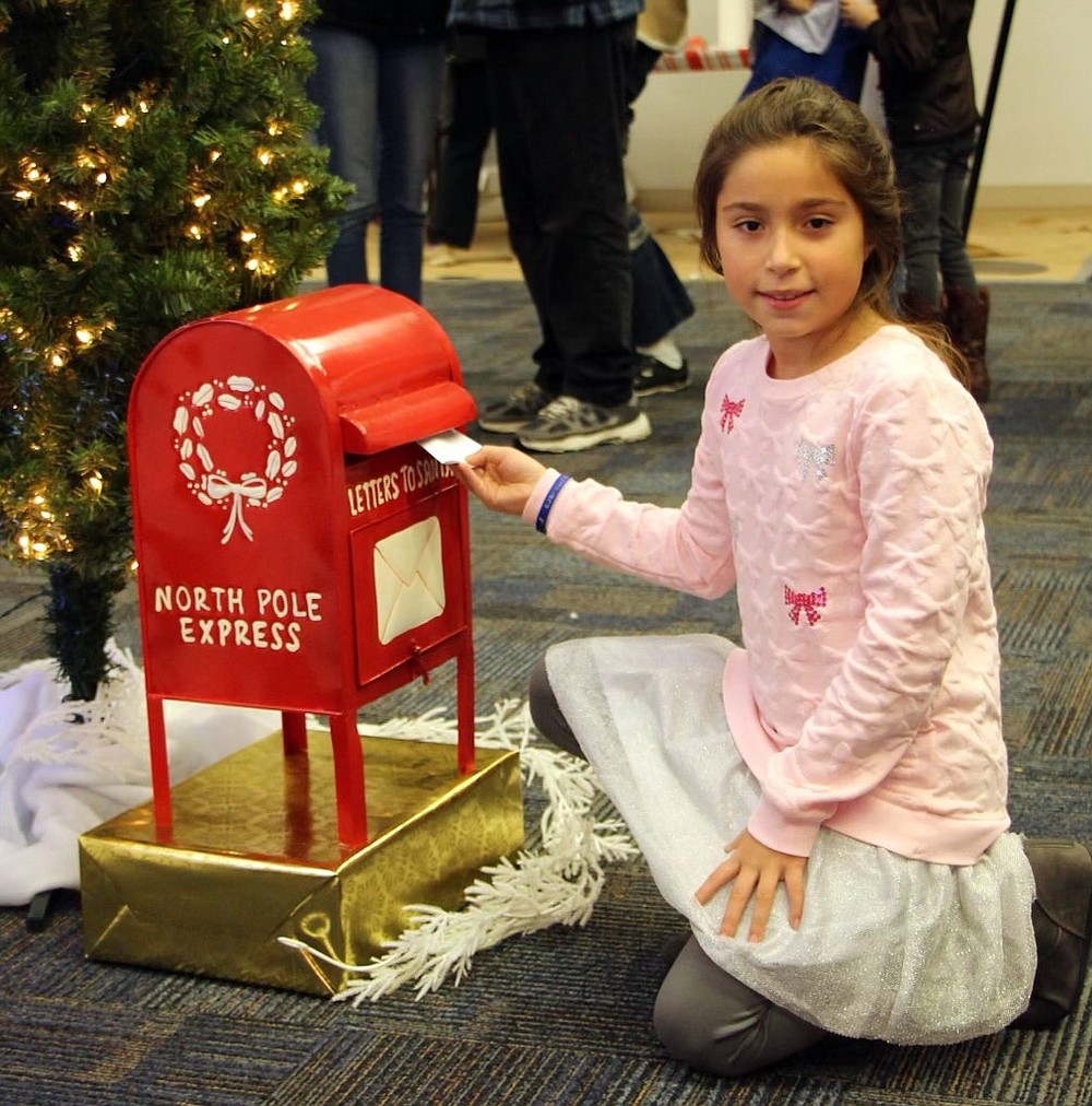 Mia Perri sends a letter to Santa at a past Eagle Wonderland event. (Photo courtesy of Dr. Tom Cutrer)
