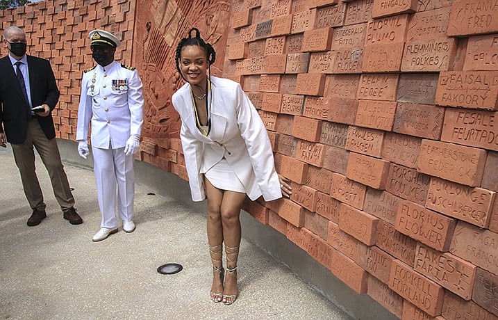 Rihanna poses for a photo at Golden Square Freedom Park after becoming Barbados 11th National Hero, during the National Honors ceremony and Independence Day Parade, in Bridgetown, Barbados, Tuesday Nov. 30, 2021. Barbados stopped pledging allegiance to Queen Elizabeth II on Tuesday as it shed another vestige of its colonial past and became a republic for the first time in history. (AP Photo/David McD Crichlow)