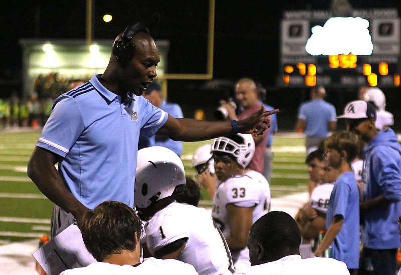 Pulaski Academy head coach Anthony Lucas talks with his players on the sidelines during the first quarter of Pulaski Academy's 63-28 win on Friday, Oct. 8, 2021, at Bulldog Stadium in White Hall. 
More photos at www.arkansasonline.com/109pawh/
(Arkansas Democrat-Gazette/Thomas Metthe)