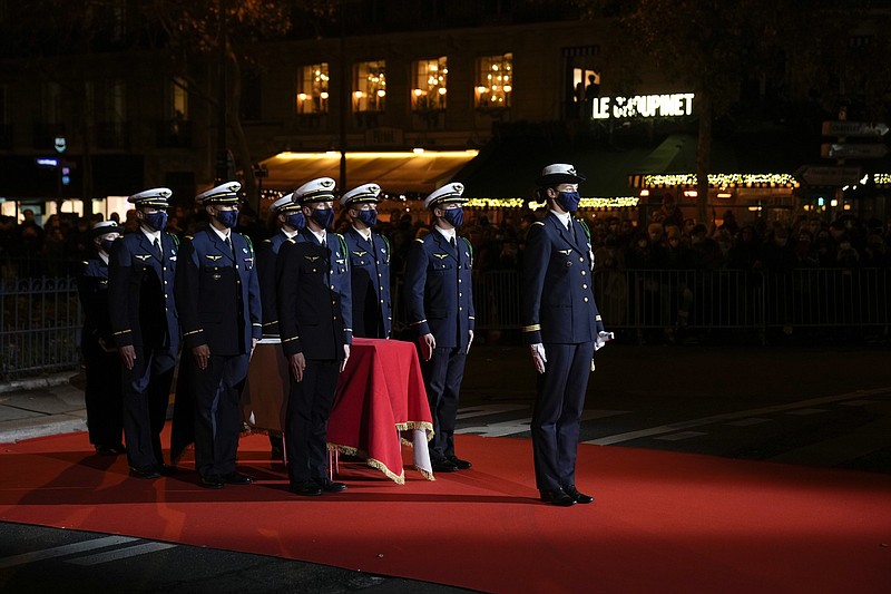 The coffin with soils from the U.S., France and Monaco is carried towards the Pantheon monument in Paris, France, Tuesday, Nov. 30, 2021, where Josephine Baker is to symbolically be inducted, becoming the first Black woman to receive France's highest honor. Her body will stay in Monaco at the request of her family. (AP Photo/Christophe Ena)