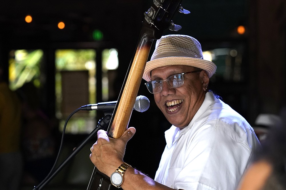 Humberto Upierre performs with the Ball &amp;amp; Chain trio at the Ball &amp;amp; Chain bar along Calle Ocho, Tuesday, Nov. 16, 2021, in the Little Havana neighborhood in Miami. Cooped-up tourists eager for a taste of Florida&#x27;s sandy beaches, swaying palm trees and warmer climates are visiting the Sunshine State in droves, topping pre-pandemic levels in recent months. (AP Photo/Lynne Sladky)