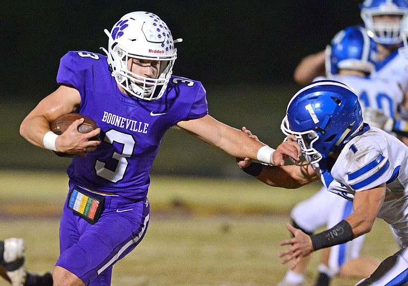 Booneville quarterback Randon Ray (3) gets by Paris' Blake Martines (1) with a straight-arm on Friday, Oct 29, 2021 in Booneville. The Bearcats will travel to Searcy on Friday to take on Harding Academy in a Class 3A state semifinal game.
(Special to NWA Democrat Gazette/Brian Sanderford)