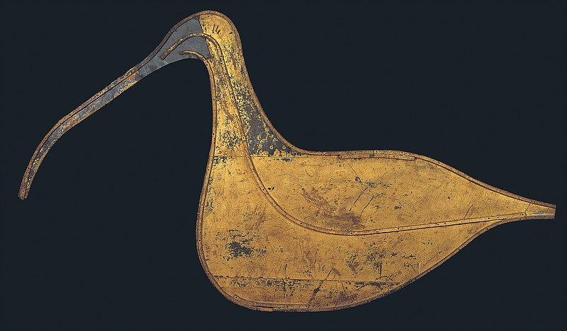 This image provided by the American Folk Art Museum shows the Hudsonian Curlew weather vane. The museum's curator, Emelie Gevalt, said one of her favorite pieces in the exhibit is the museum's own &quot;Hudsonian Curlew.&quot; The 1874 piece is large, nearly 7 feet tall and 4 feet wide. A relatively simple design, it depicts the body and distinctive curved beak of the shorebird in gold-leafed sheet metal, and once sat atop the Curlew Bay sportsmen's club in Seaville, New Jersey. (John Bigelow Taylor/American Folk Art Museum via AP)