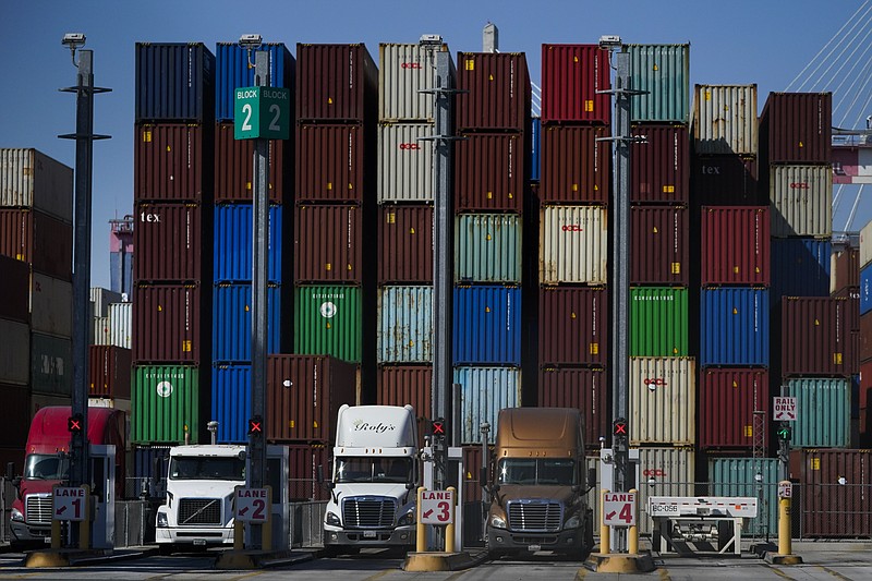 FILE - Containers are stacked at the Port of Long Beach in Long Beach in Calif., Oct. 1, 2021. U.S. manufacturing activity grew at a faster pace in November as companies continue to struggle to keep up with demand amid ongoing supply shortages and delays. The Institute for Supply Management, a trade group of purchasing managers, said Wednesday, Dec. 1, 2021 that its index of manufacturing activity rose to a reading of 61.1 in November, just above September&#x2019;s 60.8. Any reading above 50 indicates growth in the manufacturing sector. (AP Photo/Jae C. Hong, file)