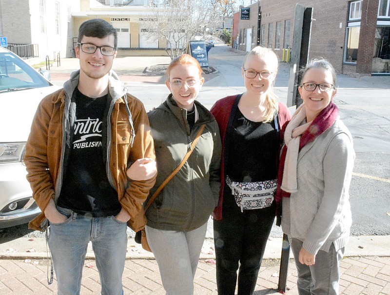Marc Hayot/Herald-Leader Trish Youmans (right), poses with her family members Sam Youmans, Victoria Youmans and Hannah Youmans. The family came downtown to shop local businesses on Small Business Saturday.