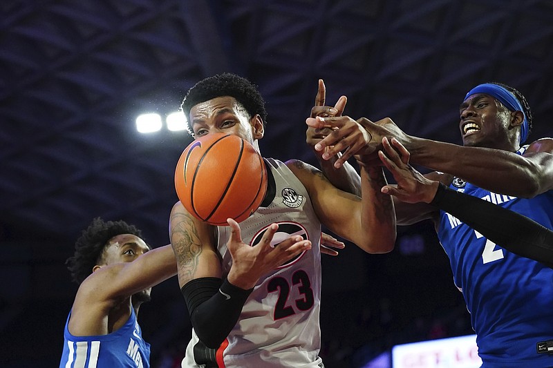 Georgia guard Braelen Bridges (23) and Memphis center Jalen Duren (2) fight for a rebound during the first half of an NCAA college basketball game Wednesday, Dec. 1, 2021, in Athens, Ga. (AP Photo/John Bazemore)