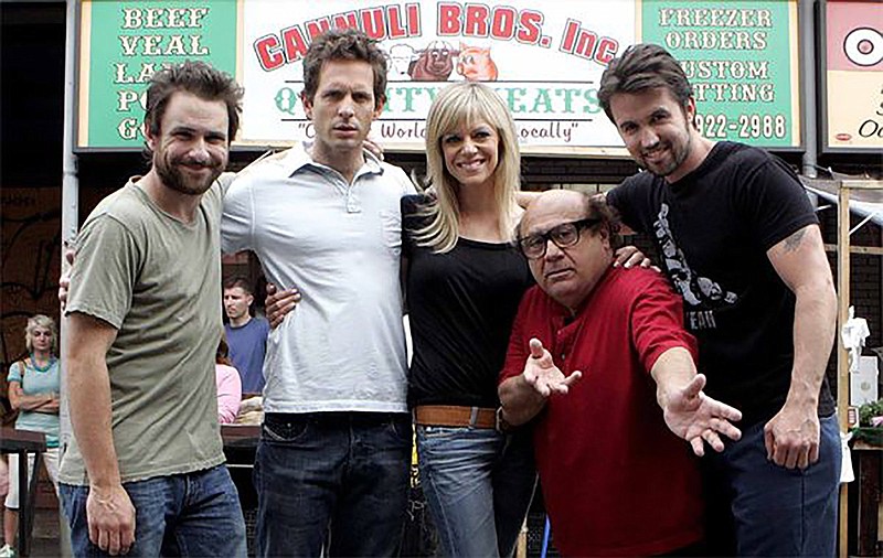Rob McElhenney (right), who was born in Philadelphia, is the star and creator of “It’s Always Sunny in Philadelphia.” His actress wife, Kaitlin Olson, is in this 2009 photo of the FX sitcom’s cast at the Italian Market, along with Charlie Day (from left), Glenn Howerton and Danny DeVito. (The Philadelphia Inquirer/TNS/Bonnie Weller)