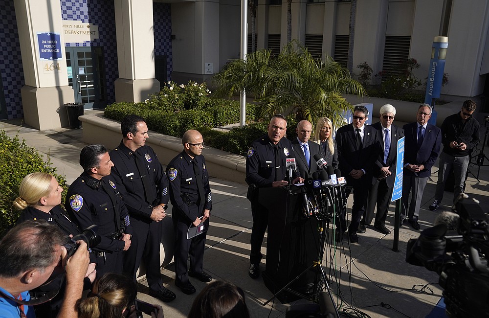 Beverly Hills Police Chief Mark G. Stainbrook, center, is surrounded by police officers and local politicians as he addresses the media, Wednesday, Dec. 1, 2021, in Beverly Hills, Calif. Jacqueline Avant, the wife of music legend Clarence Avant, was fatally shot in Beverly Hills early Wednesday. (AP Photo/Chris Pizzello)