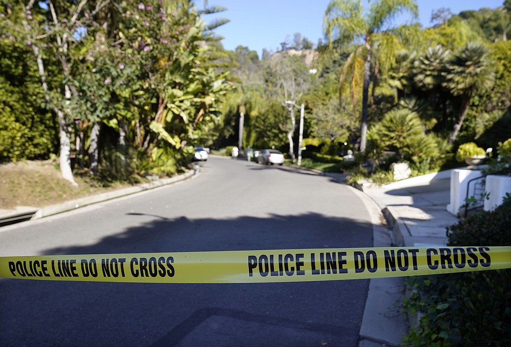 Police tape blocks the intersection of Maytor Place and Barrie Drive in the Trousdale Estates section of Beverly Hills, Calif., Wednesday, Dec. 1, 2021. Jacqueline Avant, the wife of music legend Clarence Avant, was fatally shot in the neighborhood early Wednesday. (AP Photo/Chris Pizzello)