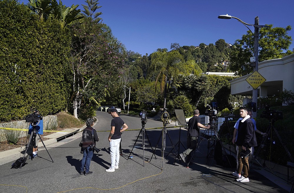 Media gather at the intersection of Maytor Place and Barrie Drive in the Trousdale Estates section of Beverly Hills, Calif., Wednesday, Dec. 1, 2021. Jacqueline Avant, the wife of music legend Clarence Avant, was fatally shot in the neighborhood early Wednesday. (AP Photo/Chris Pizzello)