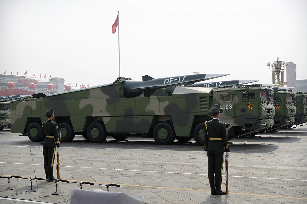FILE - Chinese military vehicles carrying DF-17 ballistic missiles roll during a parade to commemorate the 70th anniversary of the founding of Communist China in Beijing, on Oct. 1, 2019. U.S. Defense Secretary Lloyd Austin said Thursday, Dec. 2, 2021, that China’s pursuit of hypersonic weapons “increases tensions in the region” and vowed the U.S. would maintain its capability to deter potential threats posed by China. (AP Photo/Ng Han Guan, File)