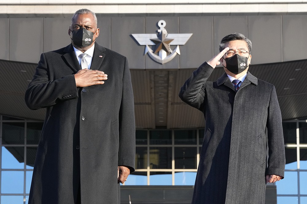 U.S. Defense Secretary Lloyd Austin, left, and South Korean Defense Minister Suh Wook salute during a welcoming ceremony at the Defense Ministry in Seoul, South Korea, Thursday, Dec. 2, 2021. (AP Photo/Ahn Young-joon, Pool)