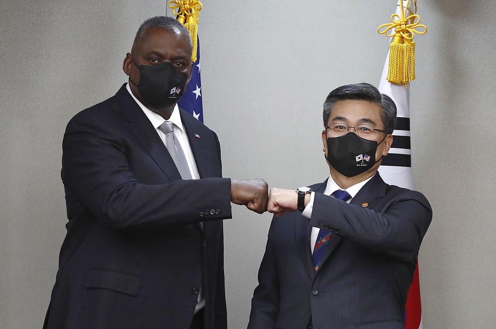 U.S. Secretary of Defense Lloyd Austin, left, bumps elbows with South Korean Defense Minister Suh Wook prior the 53rd Security Consultative Meeting a&amp;#x200b;t the Ministry of National Defense in Seoul, South Korea, Thursday, Dec. 2, 2021. (Jeon Heon-kyun/Pool Photo via AP)