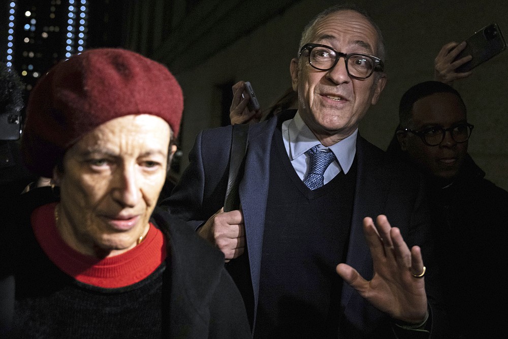 Kevin Maxwell and Isabel Maxwell, siblings of Ghislaine Maxwell, leave the federal courthouse following testimony in their sister's sex trafficking trial, Wednesday, Dec. 1, 2021, in New York. (AP Photo/Yuki Iwamura)