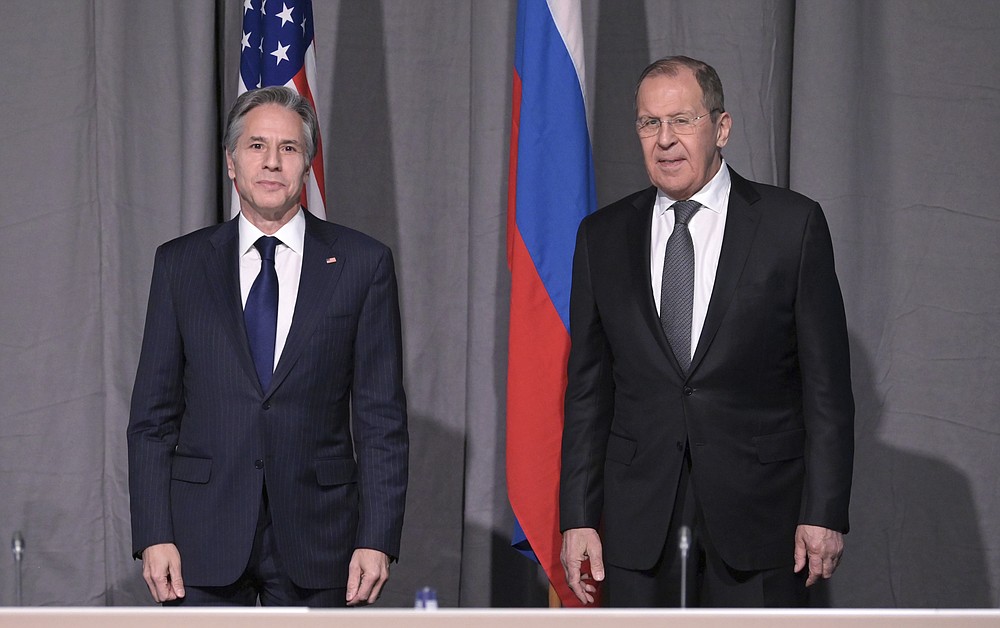 US Secretary of State Antony Blinken, left, and Russian Foreign Minister Sergey Lavrov pose for photographers on the occasion of their meeting on the sidelines of an Organization for Security and Co-operation in Europe (OSCE) meeting, in Stockholm, Sweden, Thursday, Dec. 2, 2021. (Jonathan Nackstrand/Pool Photo via AP)