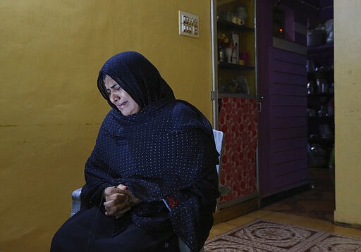 Nazima Shaikh, mother of Arbaz Mullah weeps as she speaks to the Associated Press at her home in Belagavi, India, Oct. 6, 2021. Arbaz Mullah was a Muslim man in love with a Hindu woman. But the romance so angered the woman&#x2019;s family that &#x2014; according to police &#x2014; they hired members of a hard-line Hindu group to murder him. It's a grim illustration of the risks facing interfaith couples as Hindu nationalism surges in India. (AP Photo/Aijaz Rahi)