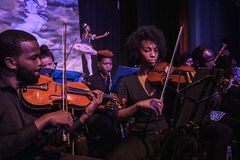 Musicians of the Nairobi Philharmonic Orchestra and foreign guest musicians play during a production of “The Nutcracker,” a ballet performed primarily at Christmastime, in the annual show of Dance Centre Kenya at the Oshwal Centre in Nairobi, Kenya, in 2018. (AFP/Getty Images/TNS/Yasuyoshi Chiba)