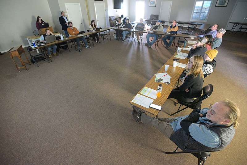 Guest speakers and members of the Sebastian County Conservation District attend a monthly meeting Wednesday at the Ben Geren Community Complex in Fort Smith. The complex, which opened late last year, offers a variety of programs and facilities, including a meeting space that can be rented. Go to nwaonline.com/211212Daily/ to see more photos.
(NWA Democrat-Gazette/Hank Layton)