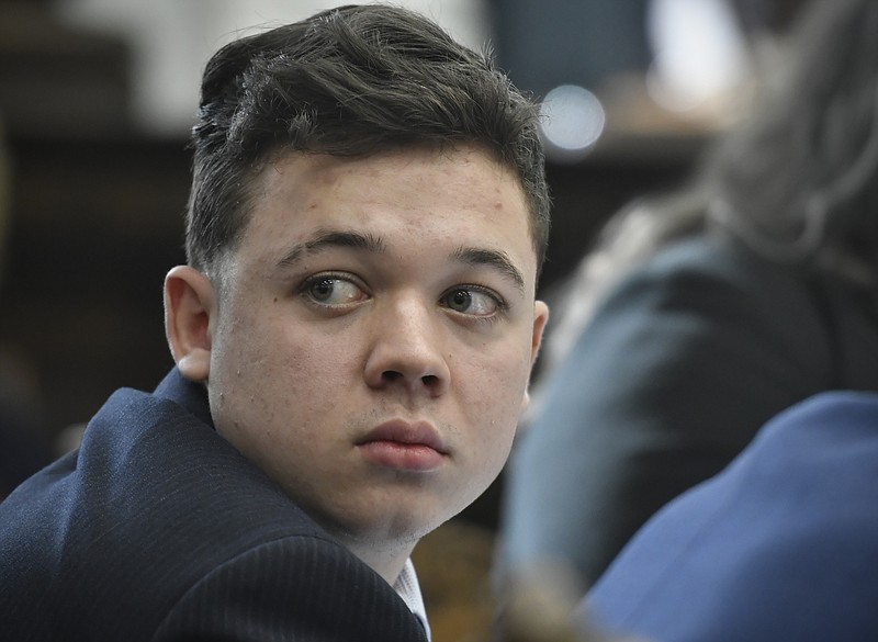 FILE -Kyle Rittenhouse looks back as Susan Hughes, the great aunt of Anthony Huber, enters the courtroom during his trial at the Kenosha County Courthouse in Kenosha, Wis., on Friday, Nov. 5, 2021.   On Friday, Dec. 3, The Associated Press reported on stories circulating online incorrectly claiming the Federal magistrate approved Kyle Rittenhouse&#x2019;s $110 Million defamation suit against LeBron James. (Sean Krajacic/The Kenosha News via AP, File, Pool, File)