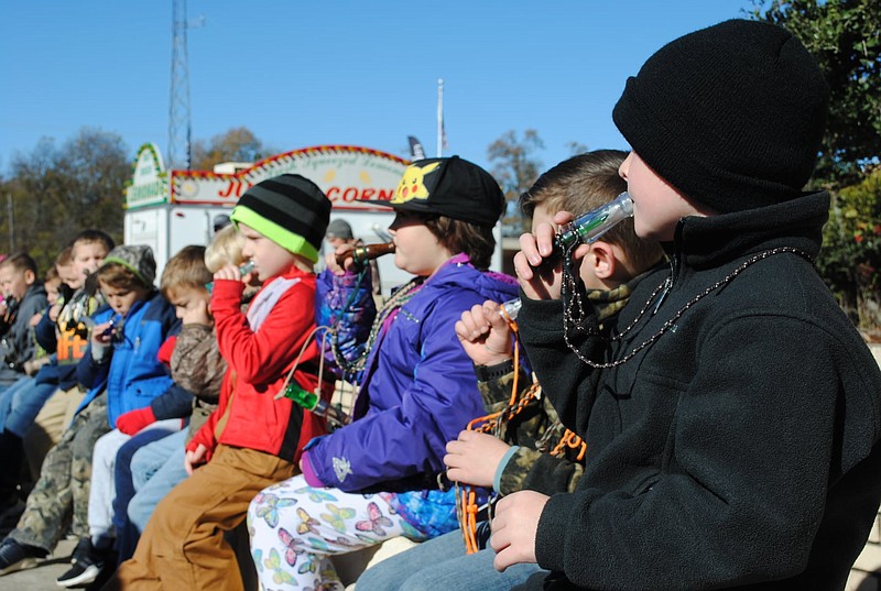 Children ages 4-8 meet at the Stuttgart stage to learn the basics of duck calling. (Special to the Commercial)