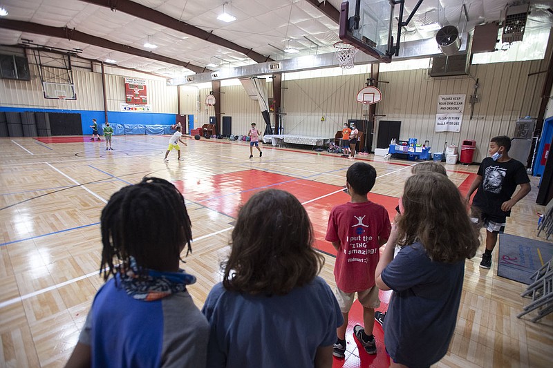 Children play July 14, 2021, at the Yvonne Richardson Community Center in Fayetteville. The city has plans to expand the center, and members of the center's nonprofit board have asked for additional staffing. (File photo/NWA Democrat-Gazette/J.T. Wampler)