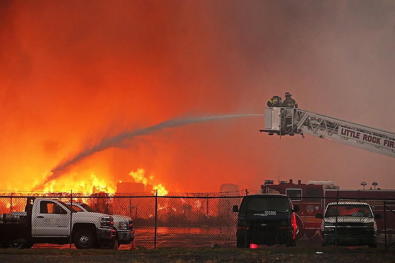 Little Rock Firefighters battle a fire that started at Goldman Recycling and has spread to other buildings on Tuesday, Sept. 21, 2021, in Little Rock. 
More photos at www.arkansasonline.com/922lrfire/
(Arkansas Democrat-Gazette/Thomas Metthe)