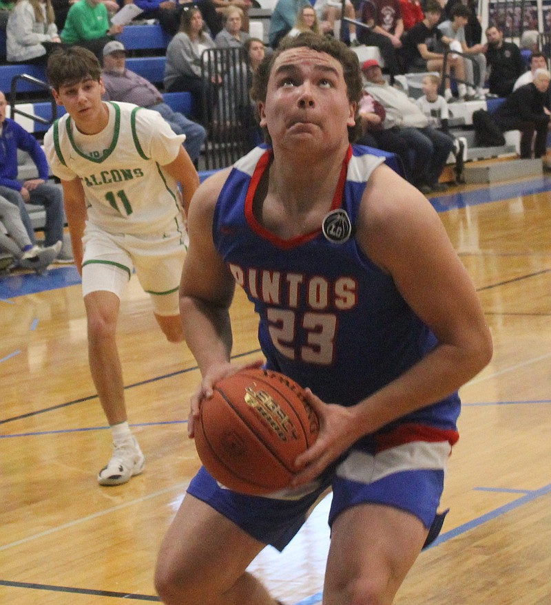 Democrat photo/Evan Holmes
Junior forward Hunter Berendzen provides an early spark for his team as he finishes a fast break lay-up. Berendzen scored nine points against Blair Oaks Saturday.