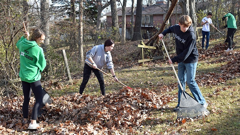 Gerry Tritz/News Tribune
From left, Blair Oaks High School students Avery Schoenenberg, Sierra Durr and Aidan Bolinger were among eight area high school students participating in Operation Leaf Relief Sunday.