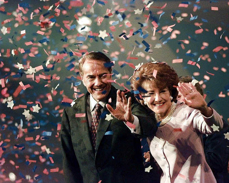 The Associated Press
Bob Dole and his wife, Elizabeth, wave from the podium on the floor of the Republican National Convention in San Diego,  Aug. 15, 1996, as confetti falls after Dole accepted the Republican presidential nomination.