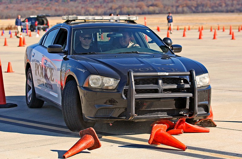 Law enforcement officers with the city of Benton train on advanced driving techniques at the Conway Municipal Airport on Wednesday, Dec. 1, 2021. (Arkansas Democrat-Gazette/ Colin Murphey)