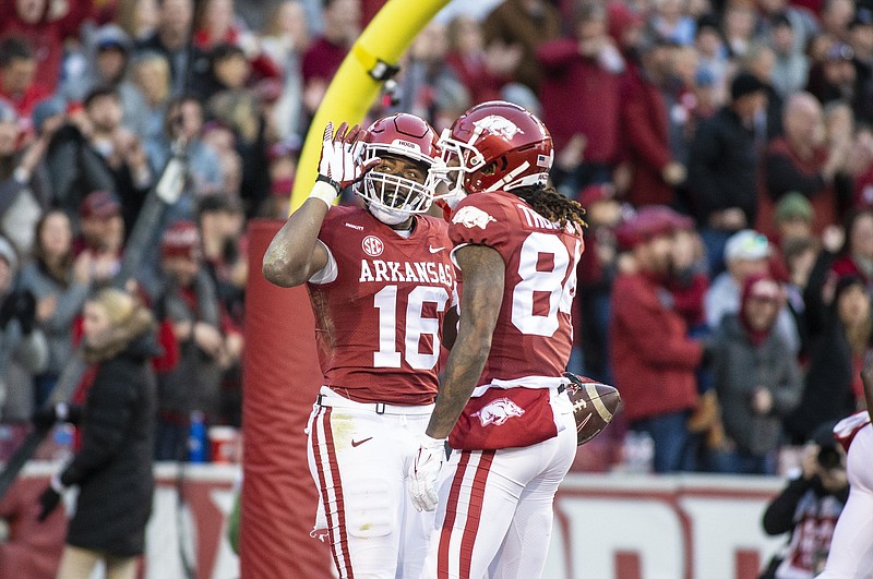 Arkansas wide receiver Treylon Burks (16) celebrates a touchdown in the third quarter of a Nov. 26 game against Missouri at Reynolds Razorback Stadium. The Razorbacks will play in the Outback Bowl against Penn State on Jan. 1, 2022. - Photo by David Beach, Special to the NWA Democrat-Gazette