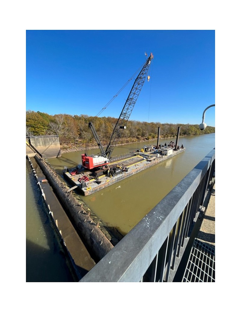 A crane barge at Thatcher Dam on Nov. 27, after the USACE completed installation of the poiree needle system, a temporary dam that will aid in efforts to repair a leak in the Lock and Dam. (Courtesy of the Union County Water Conservation Board)