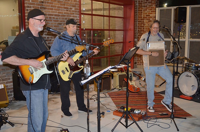 Live @ 5 hosted the music of Billy Jeter and his band Dec. 3. From left, performers are lead guitarist Perry Israel, bassist Wightman Harris, and Billy Jeter on washboard and vocals. (Special to The Commercial/Richard Ledbetter)