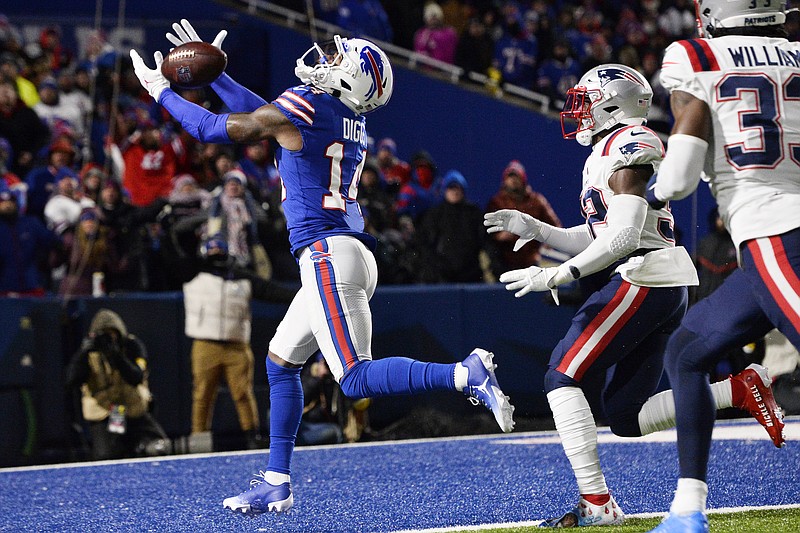Buffalo Bills wide receiver Stefon Diggs (14) can't hang onto a pass in the end zone with New England Patriots free safety Devin McCourty (32) defending during the second half of an NFL football game in Orchard Park, N.Y., Monday, Dec. 6, 2021. (AP Photo/Adrian Kraus)