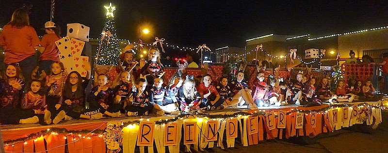 Unquestionably the largest float with most people is Flip N Cheer’s Reindeer Games entry. (Staff photo by Neil Abeles)