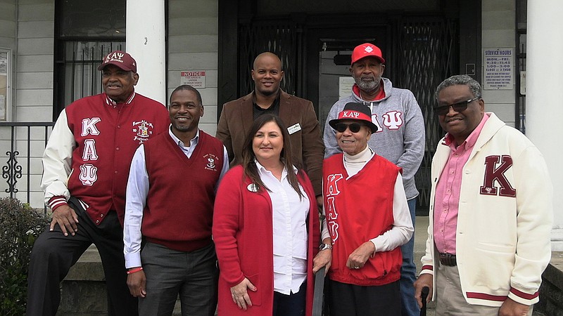 Members of the Hot Springs, Arkadelphia, and Malvern Alumni Chapter of Kappa Alpha Psi Fraternity Inc. with Jackson House’s Tammy Jones, front, center, on Tuesday after making a monetary donation this Christmas season. - Photo by Tyler Wann of The Sentinel-Record