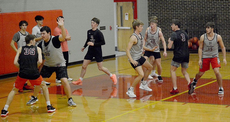 Al Gaspeny/Special to McDonald County Press
Toby Moore tries to stop Eli McClain (35) during practice Monday at McDonald County High School.