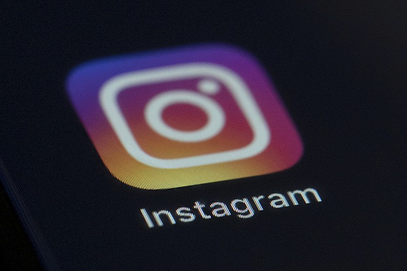 This Aug. 23, 2019 photo shows the Instagram app icon on the screen of a mobile device in New York. Instagram CEO  Adam Mosseri will appear before a Senate panel on Wednesday, Dec. 8, 2021 as the company faces scrutiny over the potential detrimental impact its social media platform has on young people. (AP Photo/Jenny Kane, file)