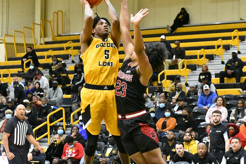 DeQuan Morris of UAPB shoots a jumper against Marquis Eaton of Arkansas State in the first half Wednesday at H.O. Clemmons Arena.